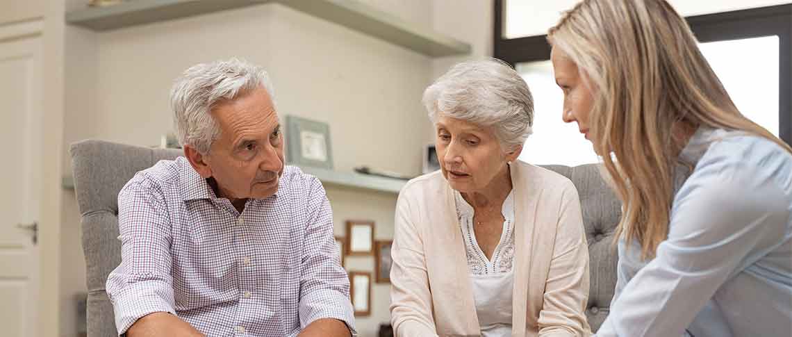 Senior couple thinking of What Property Should be Put in Living Trust